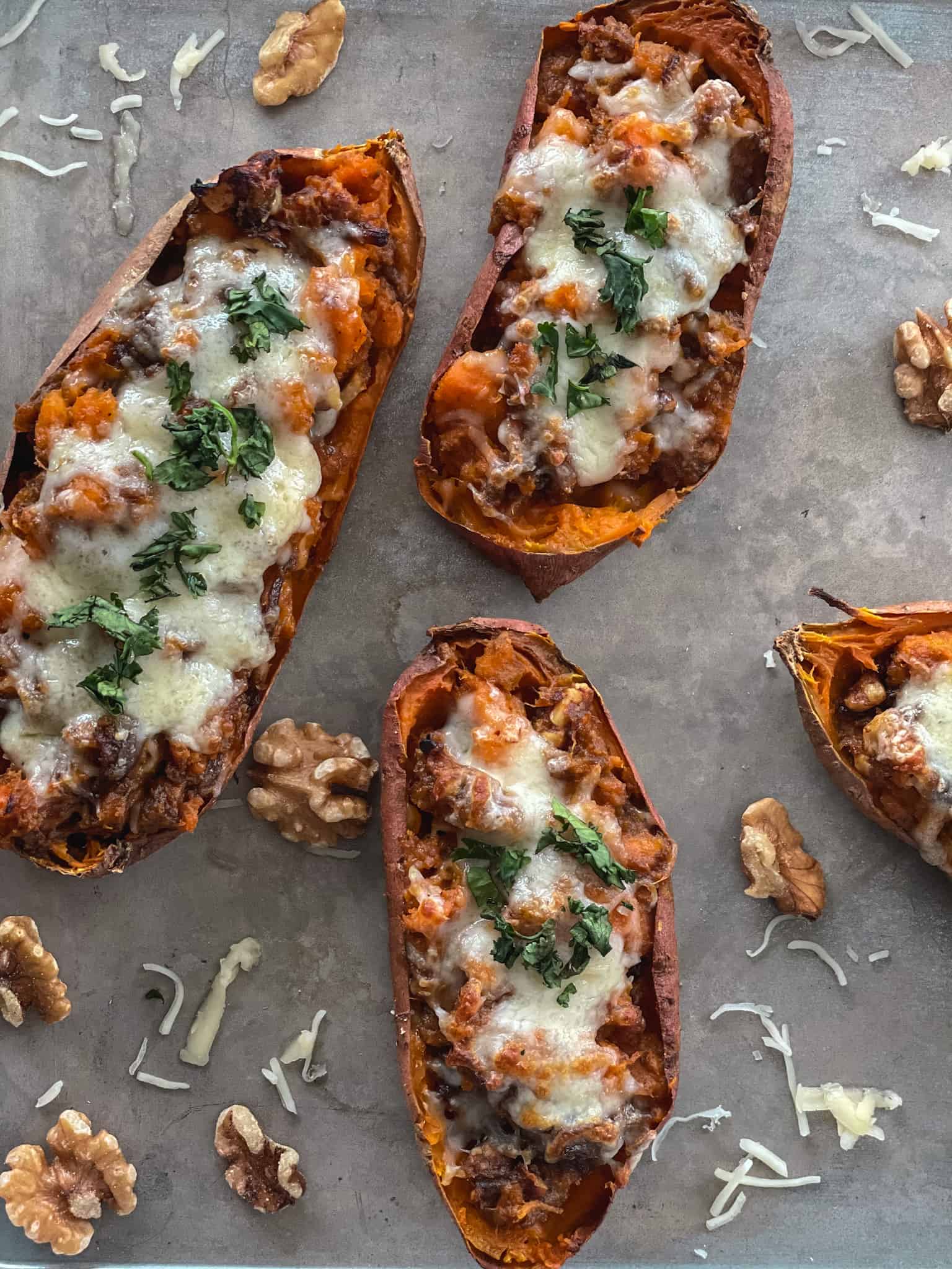 brown butter baked sweet potatoes on a pan